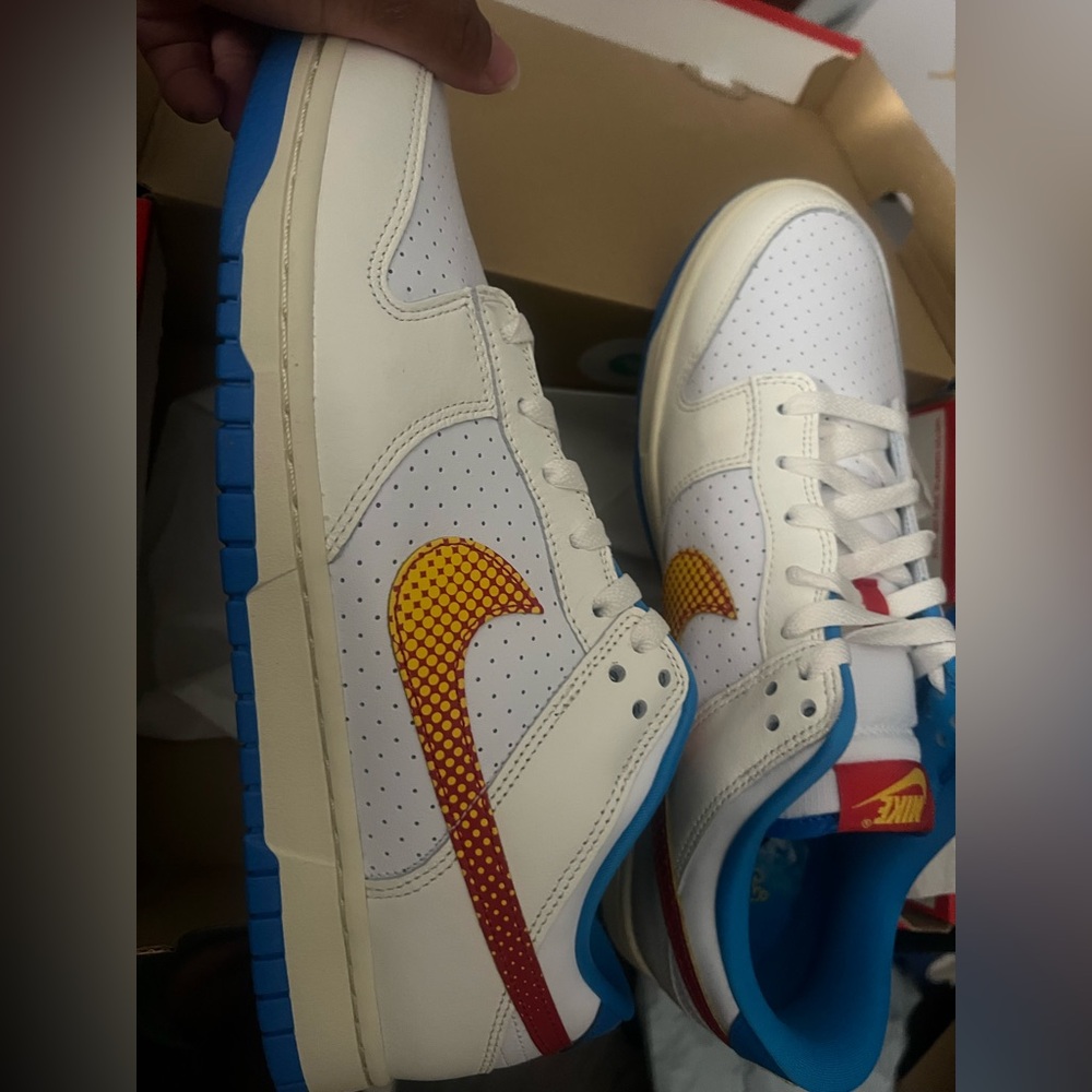 100% authentic brand new Nike Men’s White and Blue Sneakers with Red Accents.